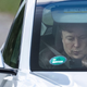 Tesla CEO Elon Musk sits in a car arriving to the construction site for a new Tesla in Gruenheide near Berlin, northeastern Germany on May 17, 2021.